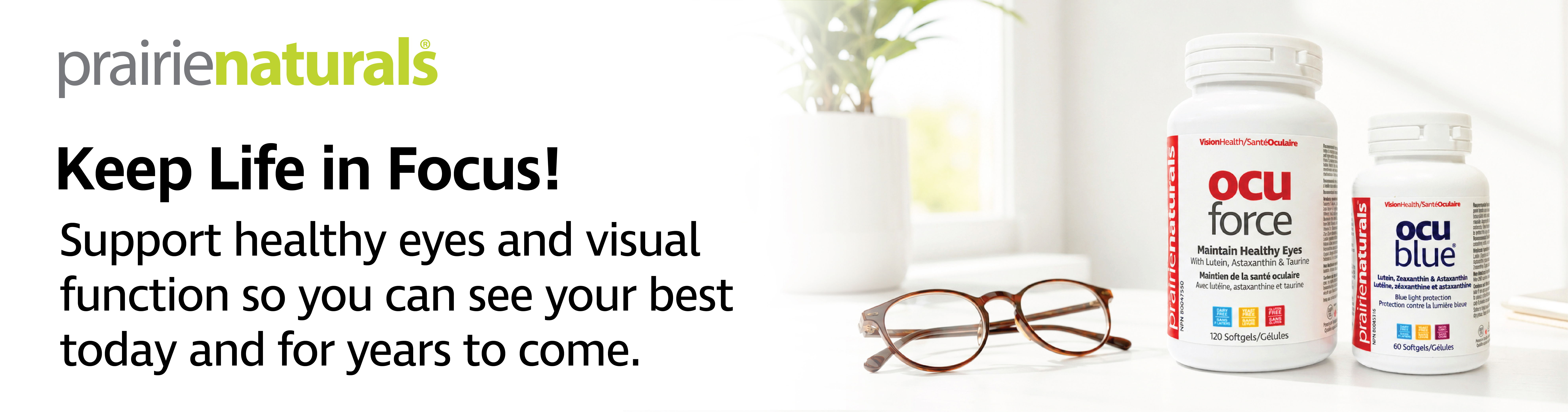 Bottles of eye health supplements with glasses and a plant background.