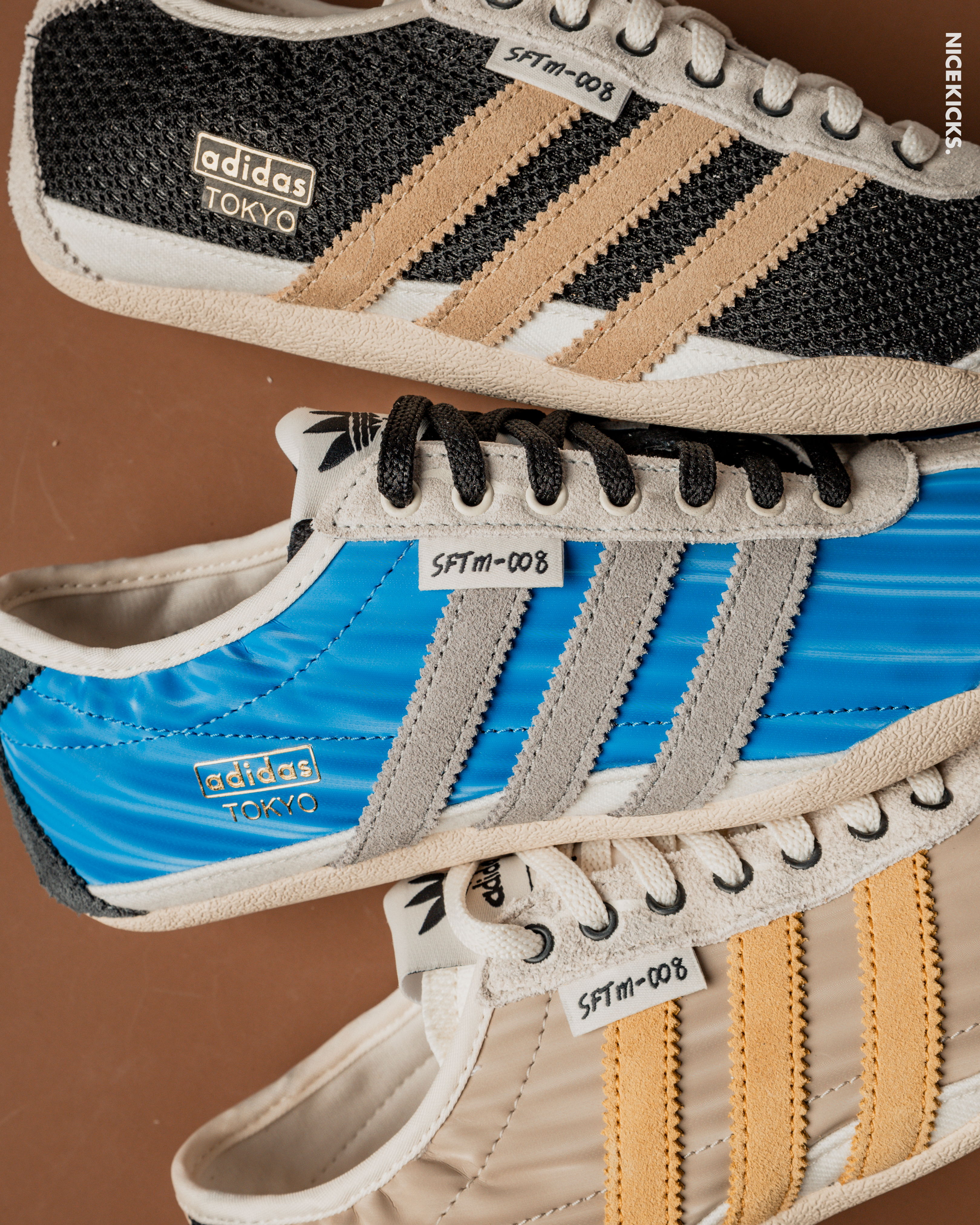 Three pairs of Adidas sneakers in different colors and designs.