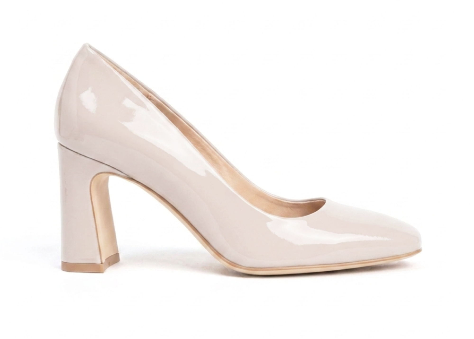A beige high heel shoe with a chunky heel.