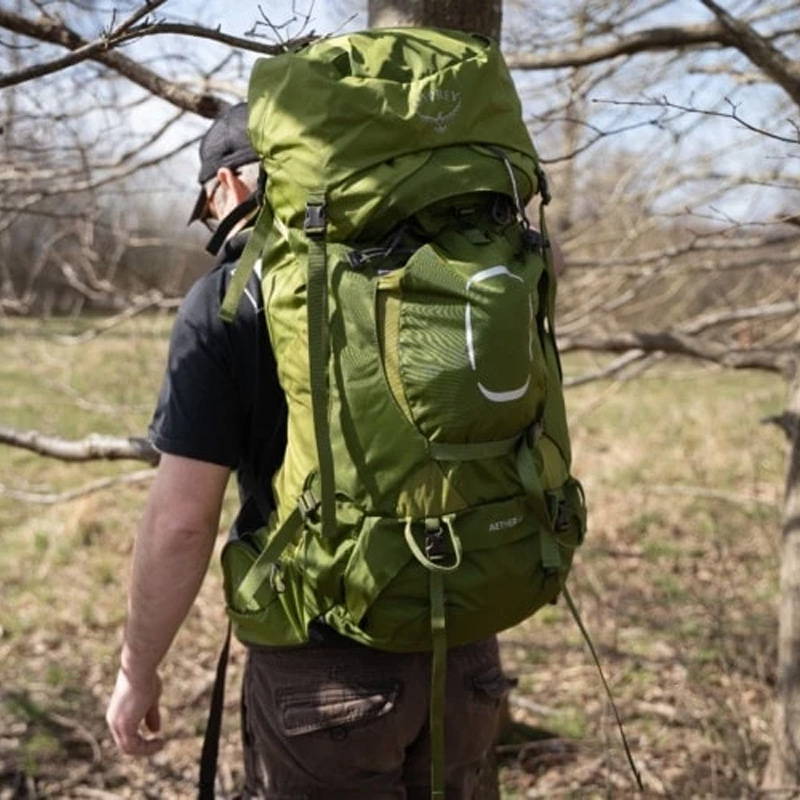 Man backpacking using Osprey Aura LT 65