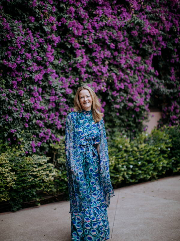 Melissa Biggs Bradley founder of Indagare wearing peacock printed silk dress in Marrakech by Ala von Auersperg