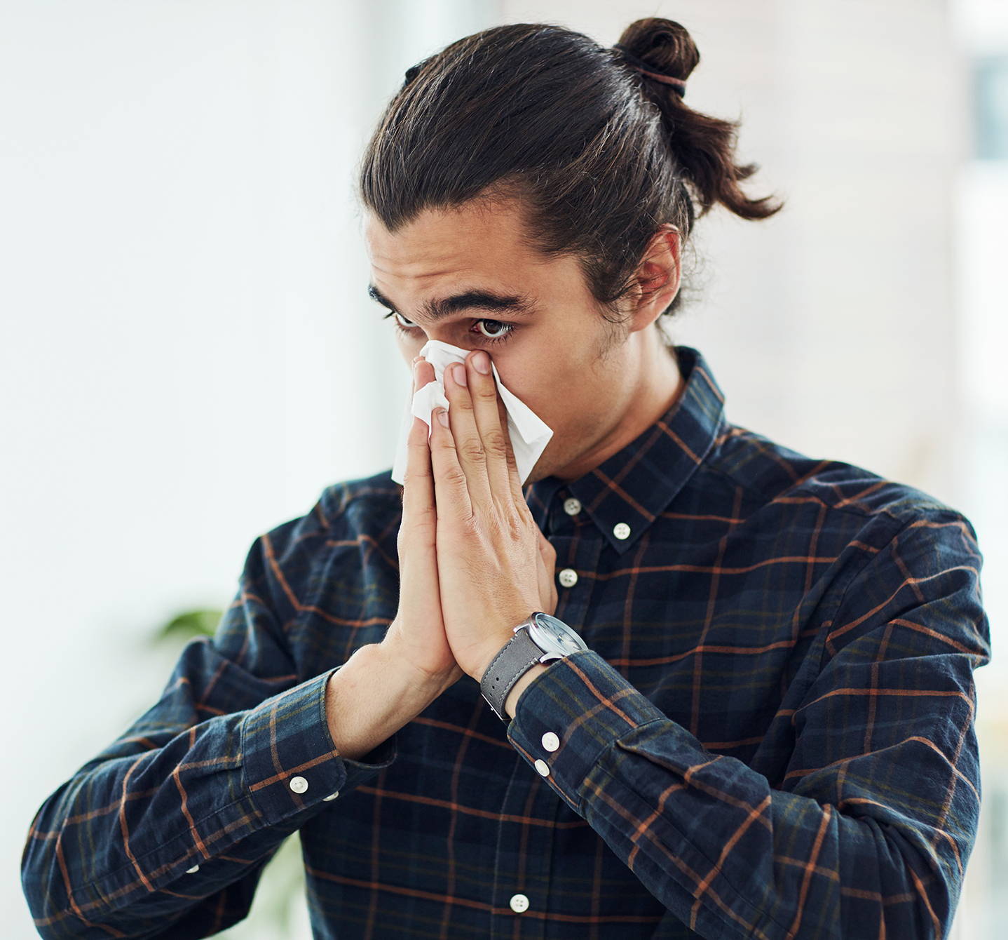 Young man with allergic rhinitis