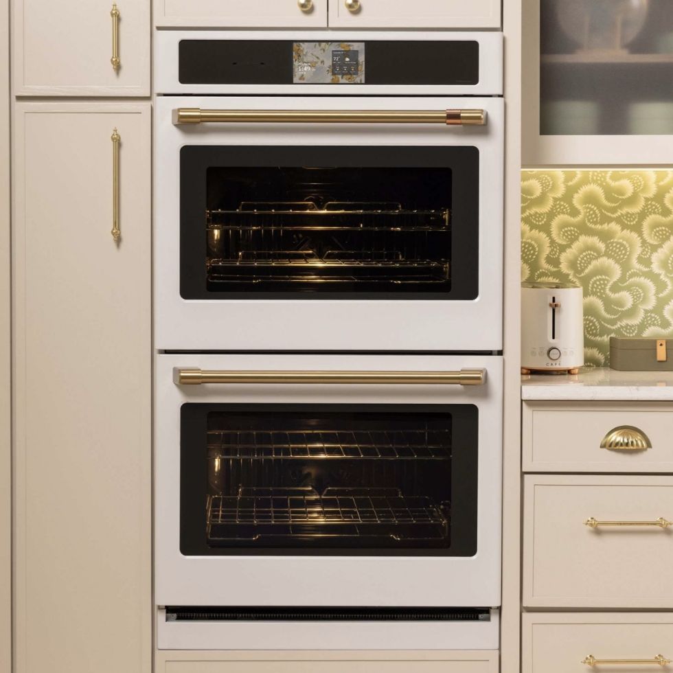 A modern kitchen with a double wall oven and cabinetry.