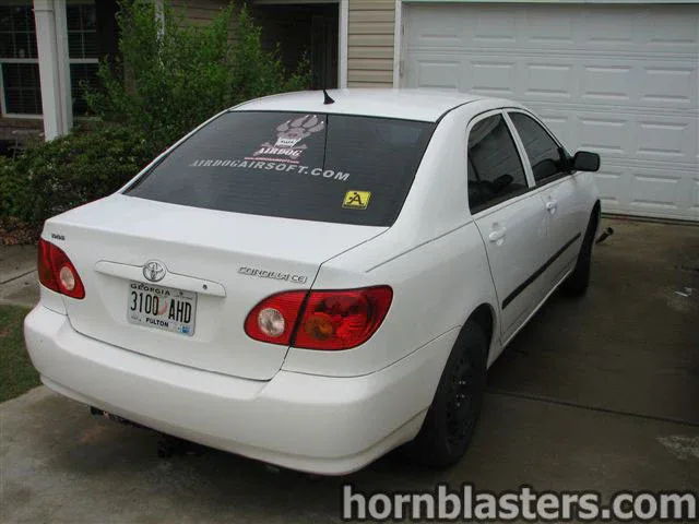 Rear view white Toyota Corolla CE Georgia plate AIRDOG decal 2001 Corolla K5LA train horn gallery photo 3