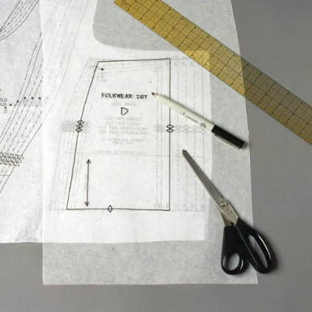 White tracing pattern paper on a garment pattern