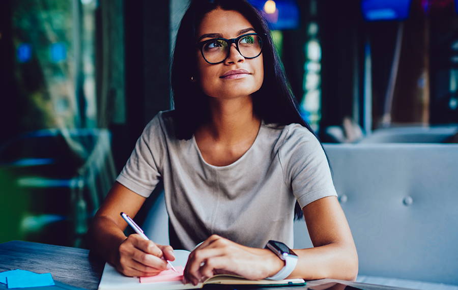 woman writing in journal