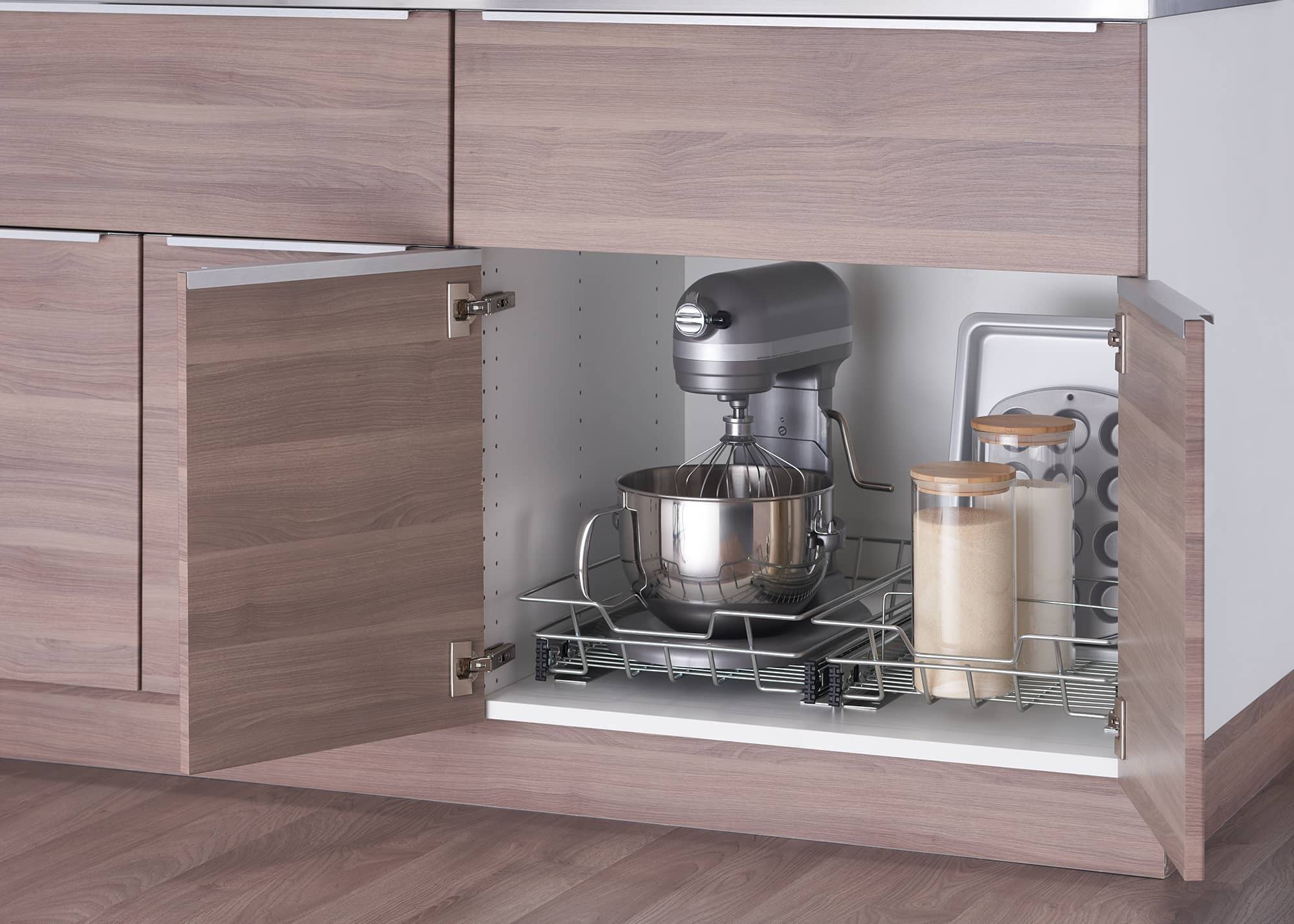 a pair of sliding drawers in a kitchen cabinet