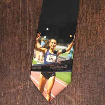 A photo tie of a marathon runner crossing the finish line 