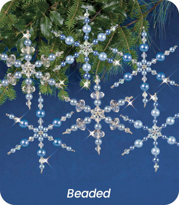 Beaded snowflakes in blue and silver on a blue background.