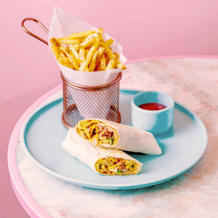 Chicken Schawarma Wrap with chips and sauce dish