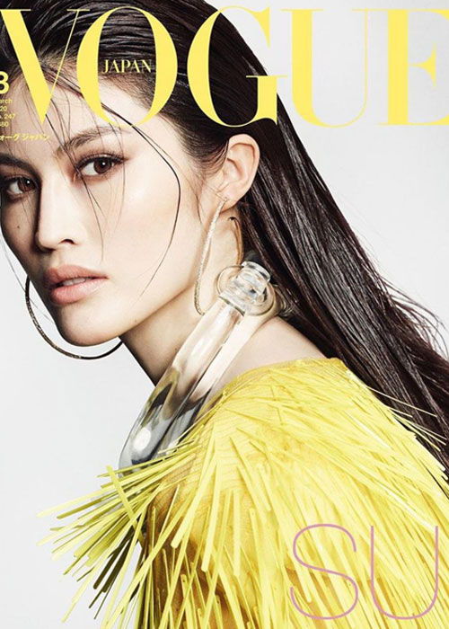 Model in yellow outfit on Vogue Japan cover.
