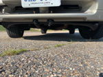 Rear three-quarter maroon gold two-tone Subaru Outback Ellie decal Virginia UHS-3559 plate parking lot Adam's 228H gallery photo 2