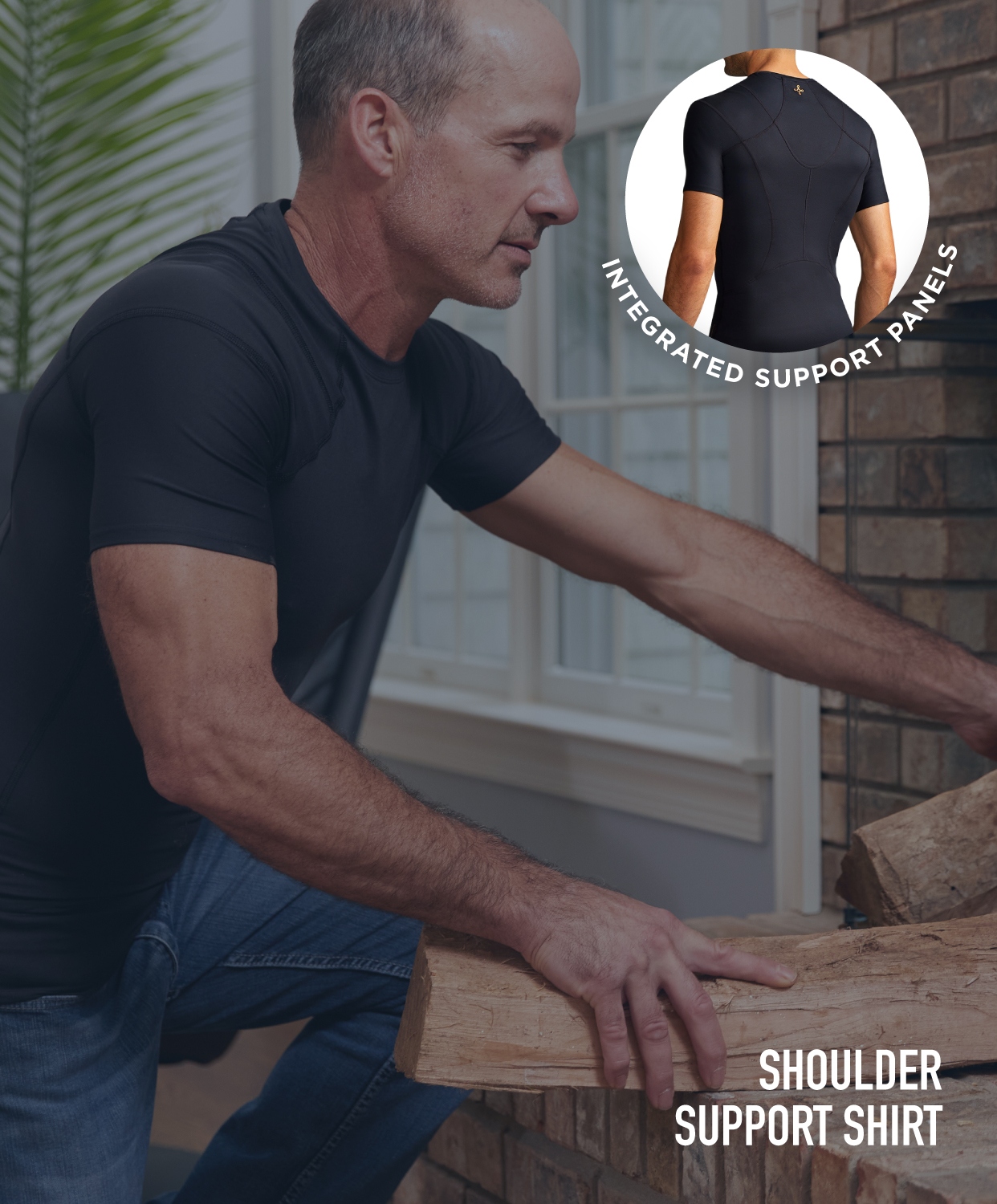 Man placing logs in a fireplace wearing the Shoulder Support Shirt 