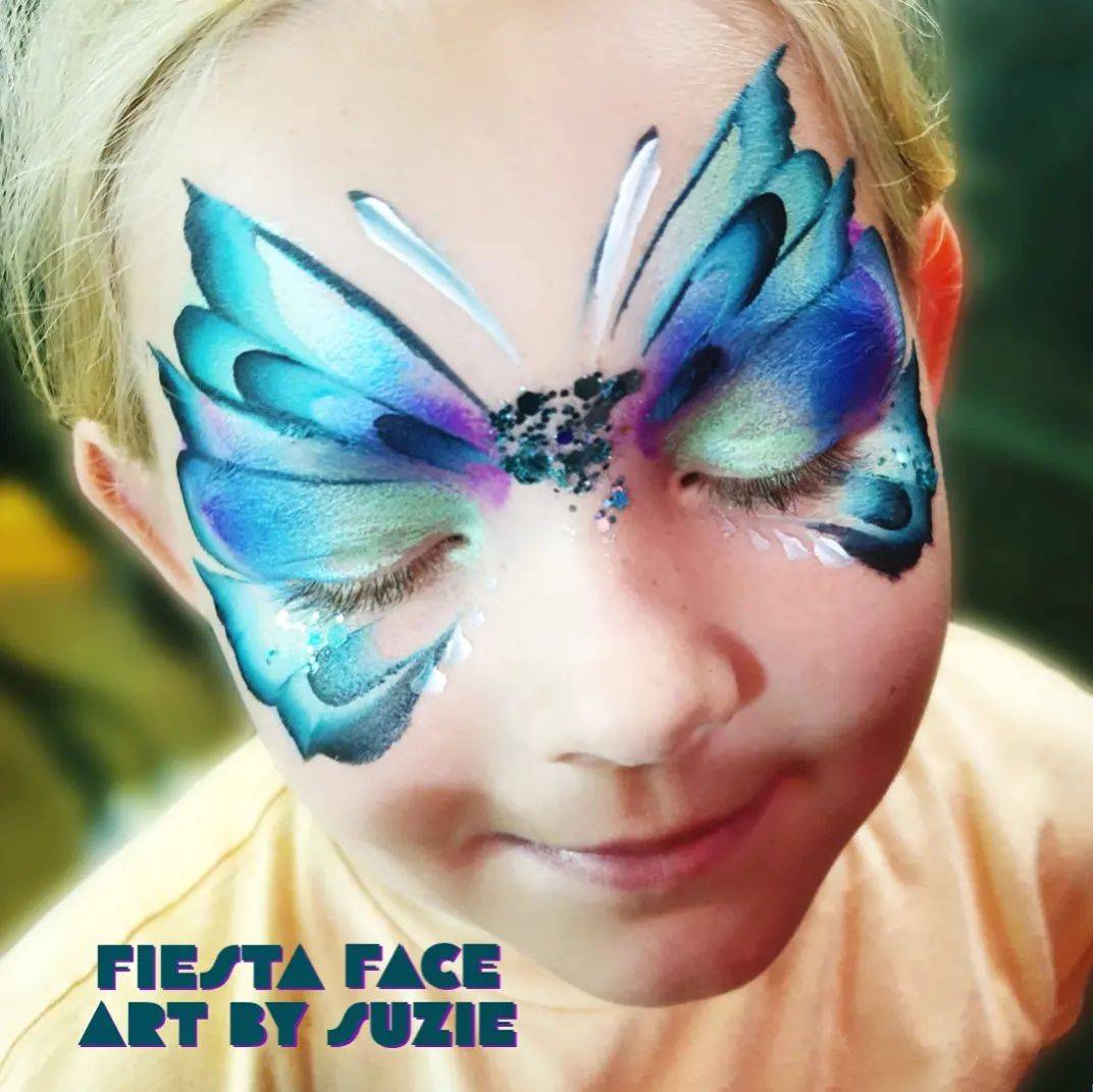 face paint butterfly mask girl, blue and green colours