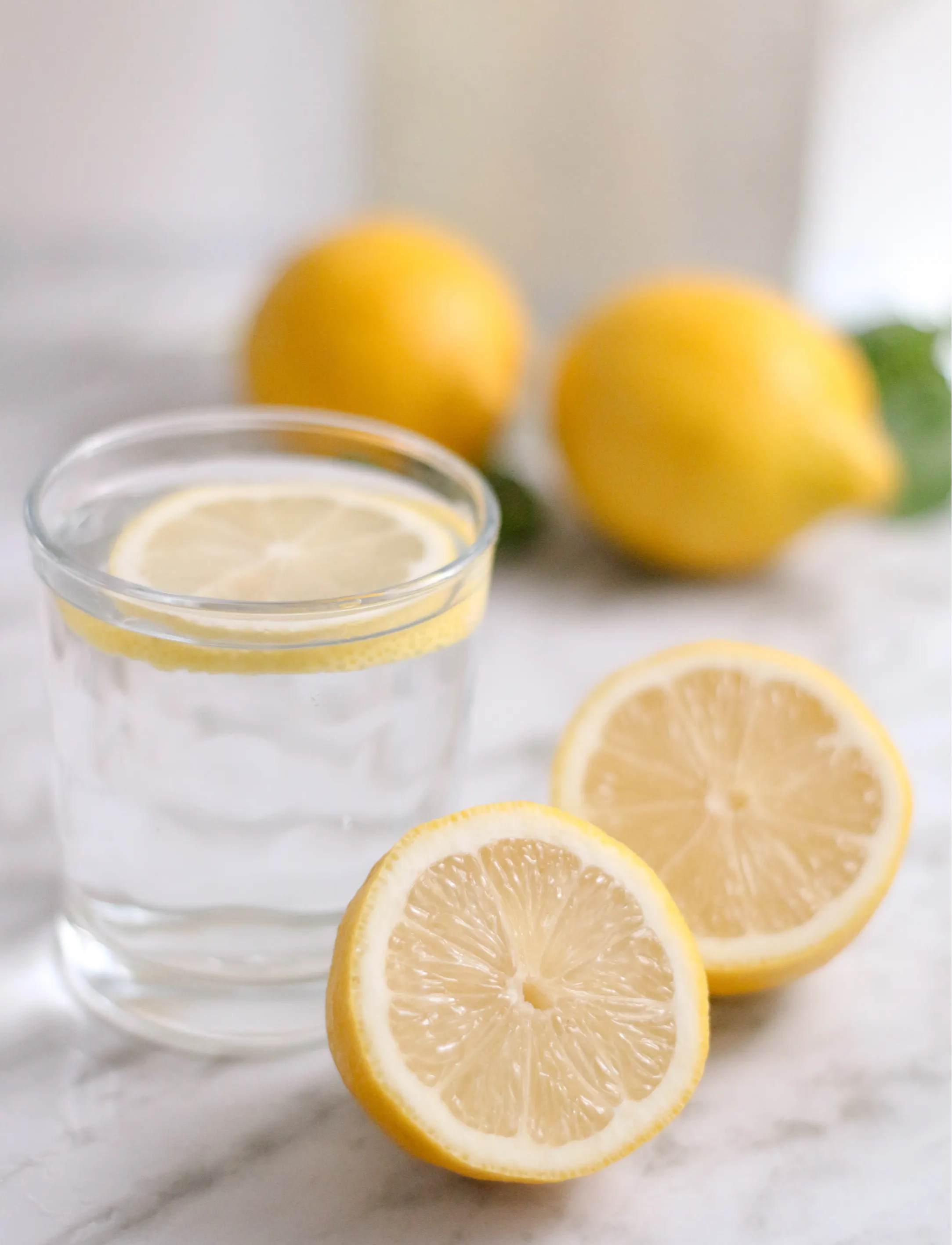 Glass of water with sliced lemons