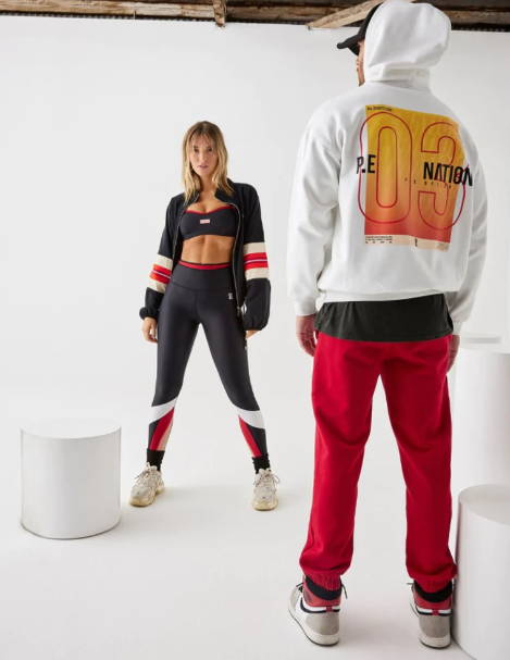 A girl and guy model activewear