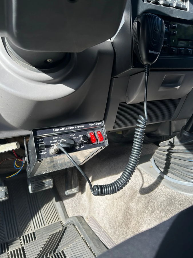 Interior under-dash HornBlasters PA-100H controller microphone and siren controls mounted in Miranda's 1994 Dodge Dakota photo 3
