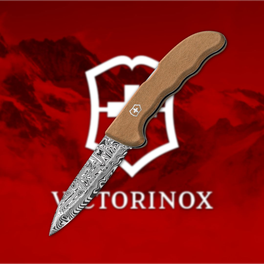 Victorinox knife with a wooden handle on a red background.