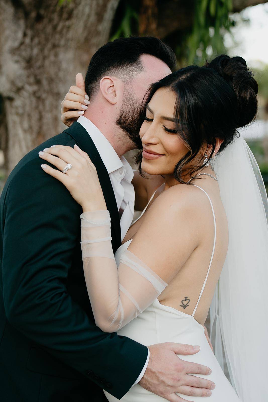 Bride and Groom holding each other