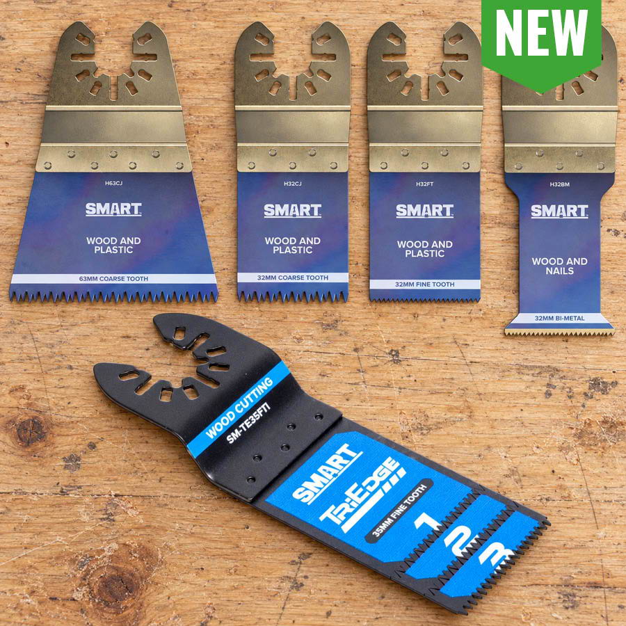 Four multi-tool blades displayed on a wooden surface with a new product tag.