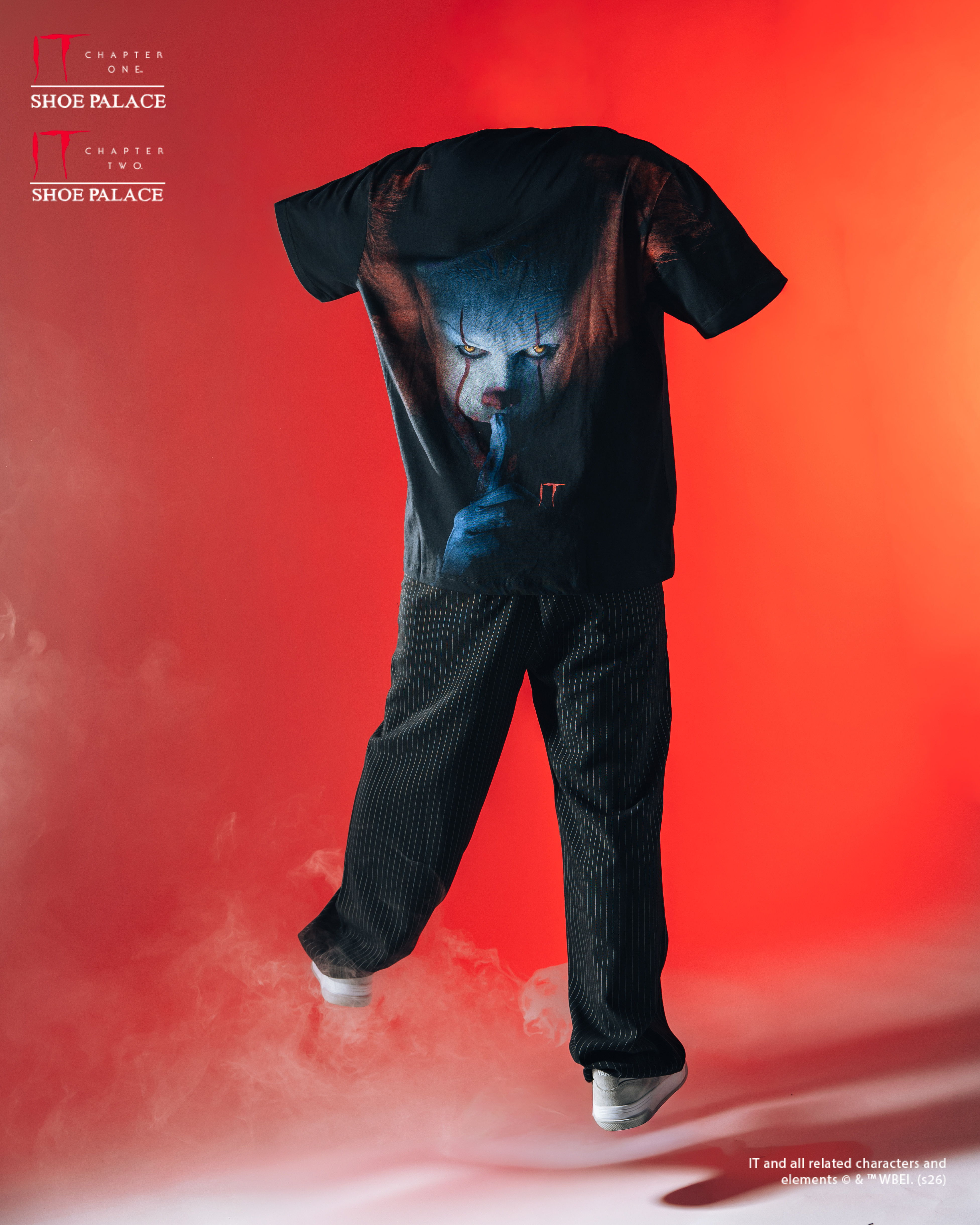 A floating outfit with a graphic design against a red background.