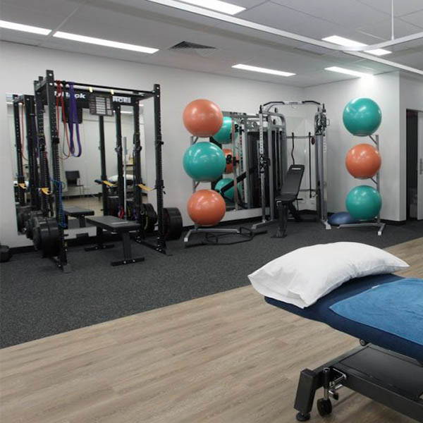 Physiotherapy Gym Fit Out. A well-organized physiotherapy facility with various exercise machines.