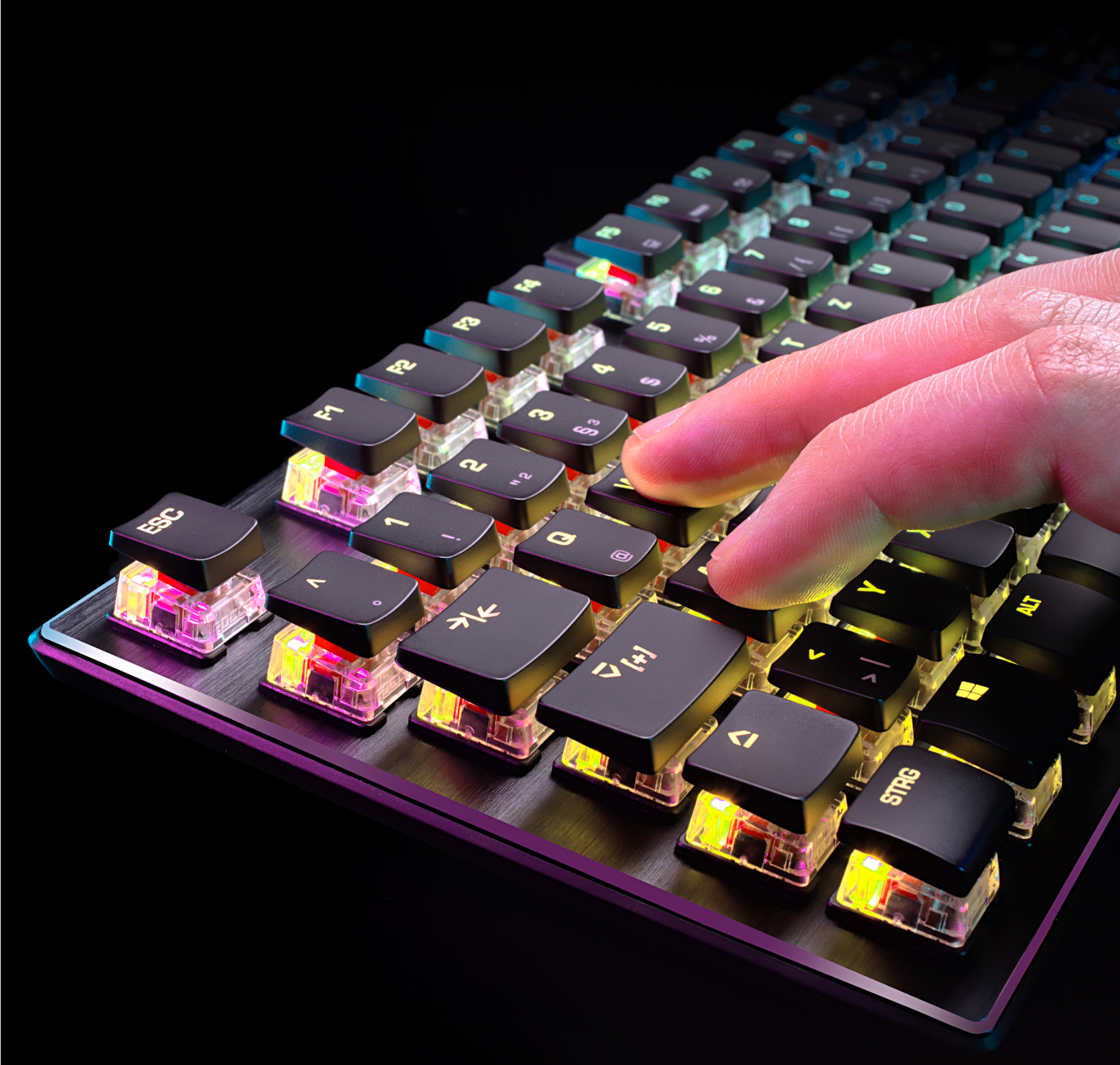 Close-up of the vulcan keyboard with 2 fingers on WASD area