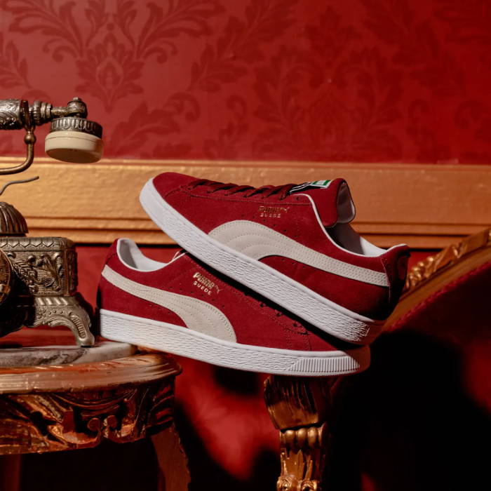 dark red puma suede shoes stacked