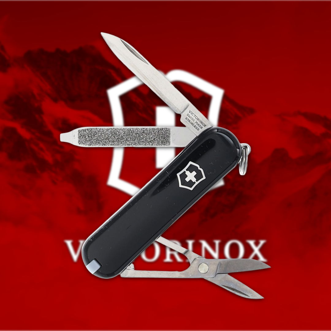 A Swiss Army knife with multiple tools on a red background.