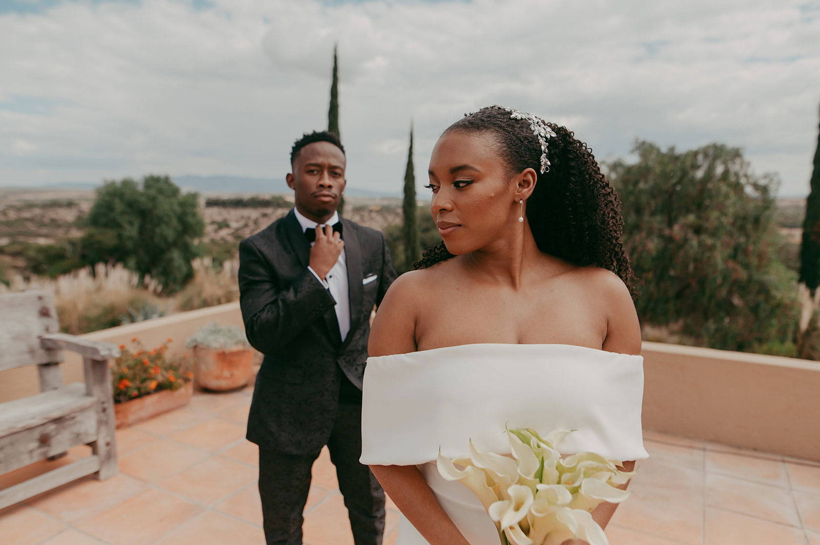 Bride and Groom fixing tie