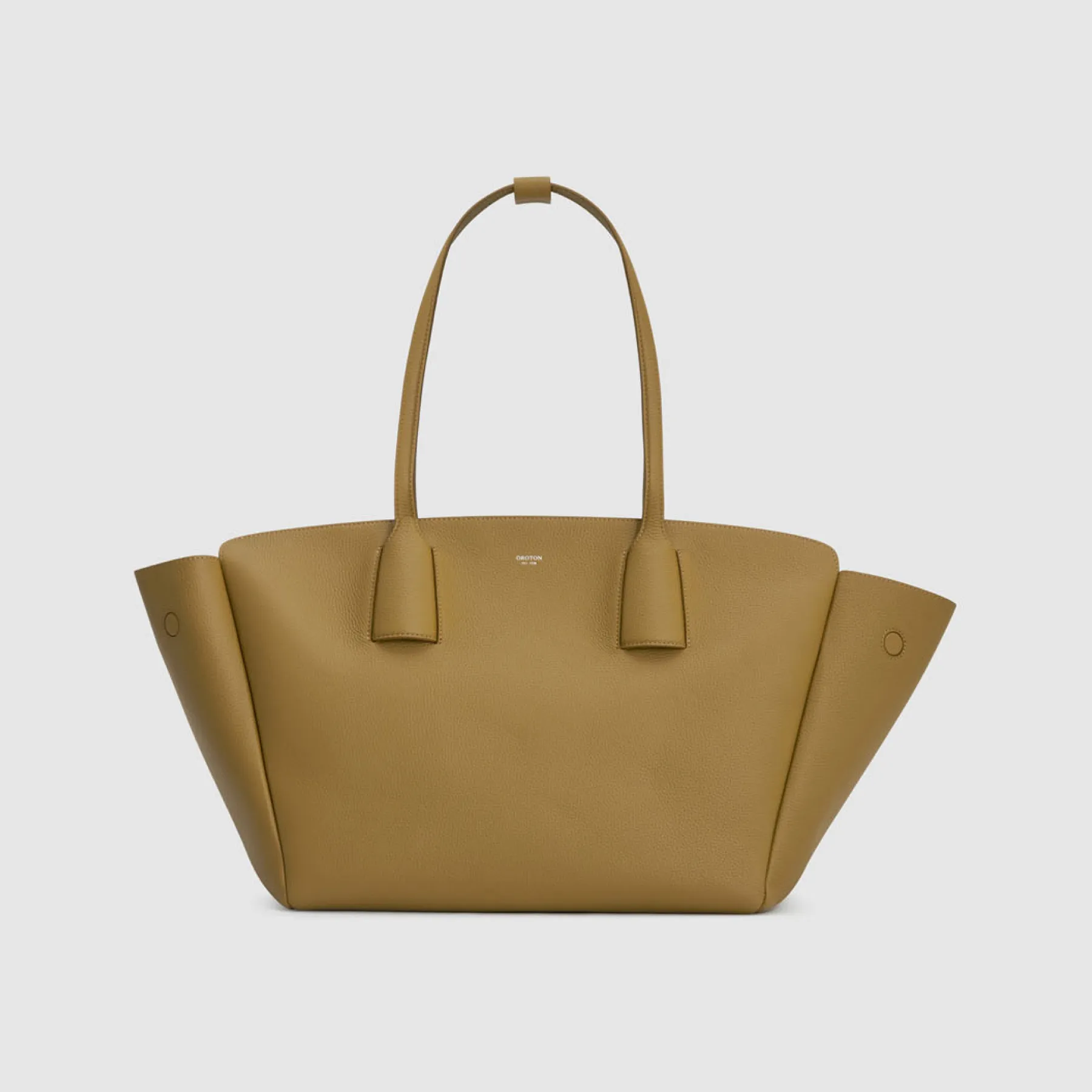 Tan leather tote bag with two handles and a structured design.