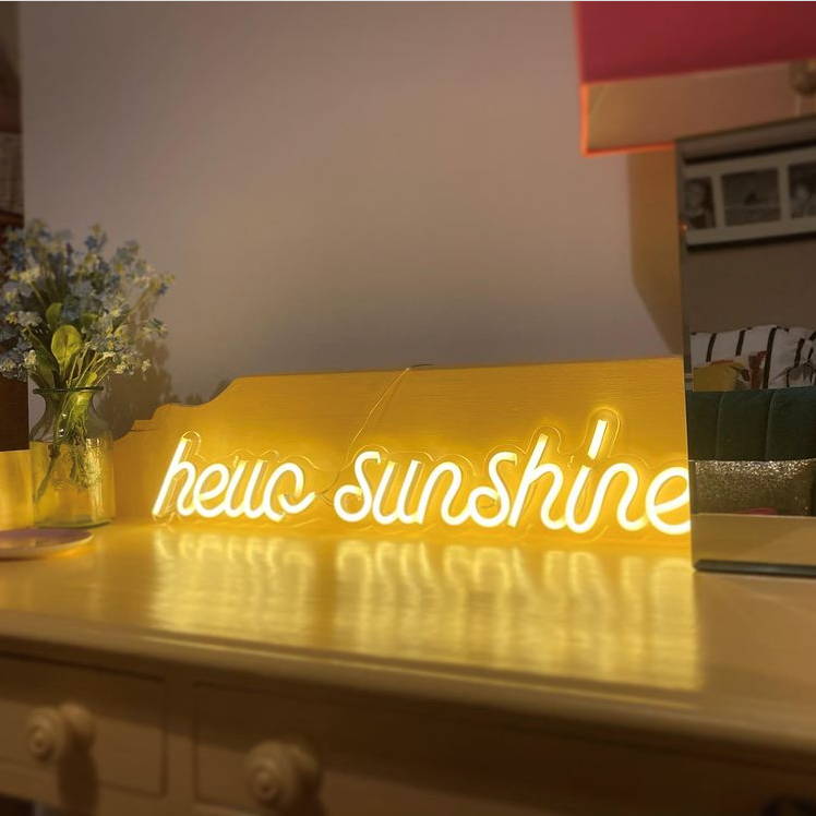 Hello sunshine neon light illuminated on table