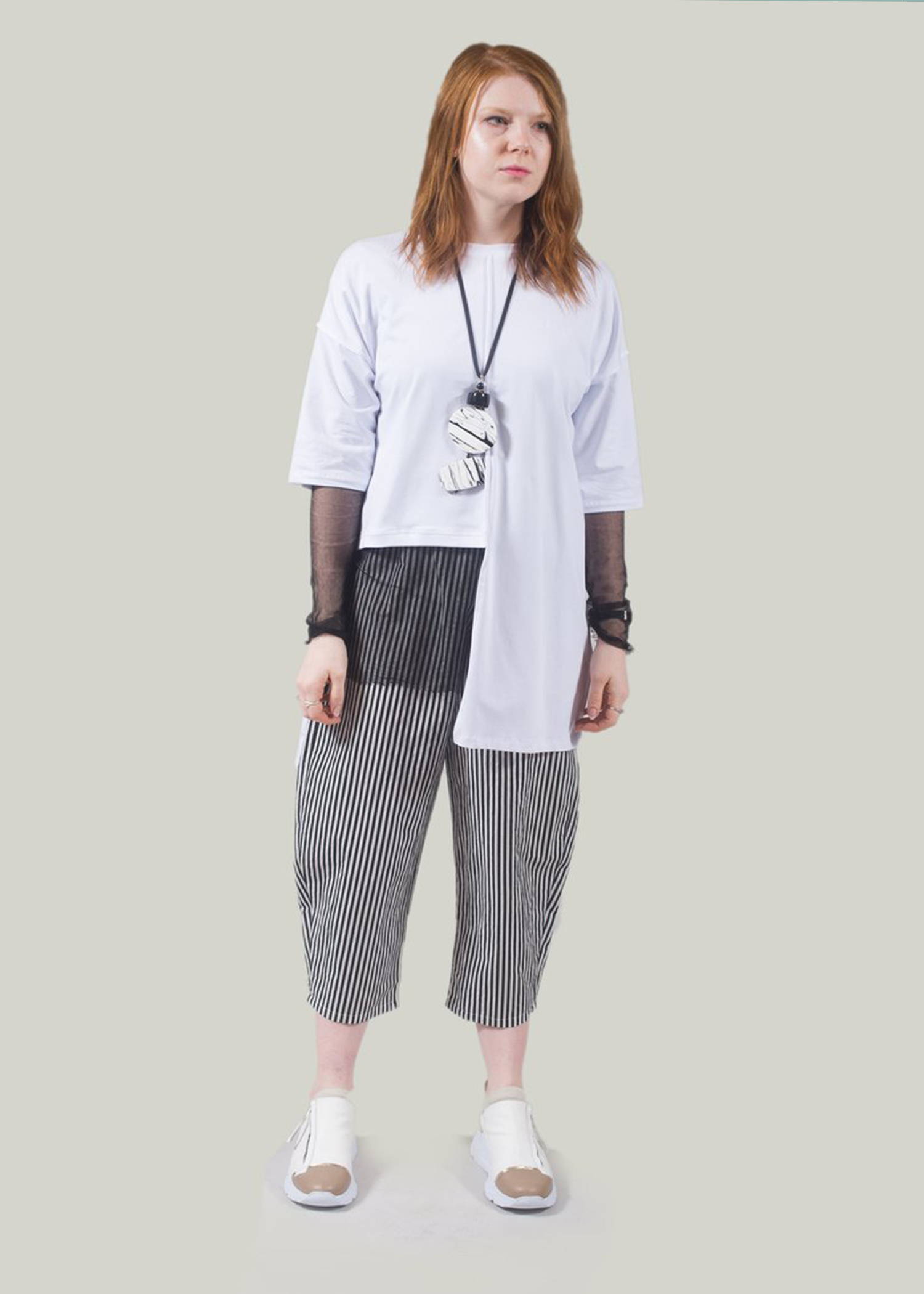 Barely there transparent pieces have become a distinct trend for SS19, giving softer  more feminine feel to your tailored cuts. Adding a layer of sheer to your outfit creates a feminine look while still keeping on trend with asymmetric pieces. We have styled this outfit with stripe trousers to add more prints.