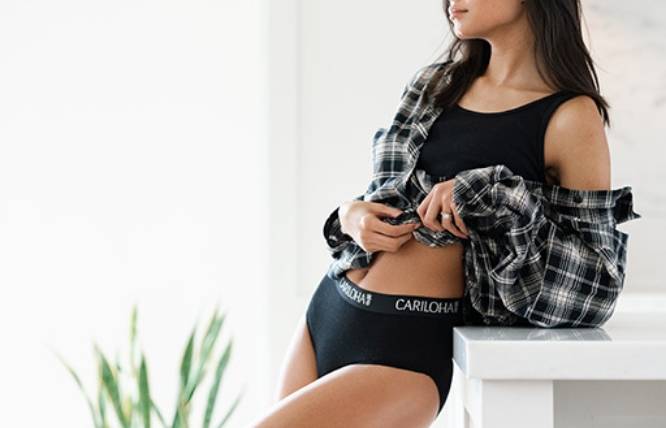 a woman wearing black cariloha underwear