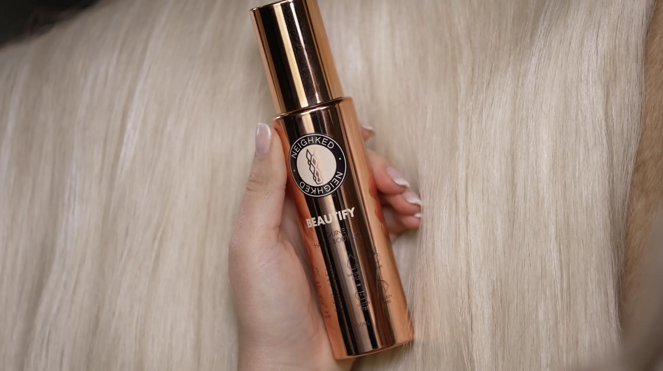 A bottle of BEAUTIFY next to a horse's mane.