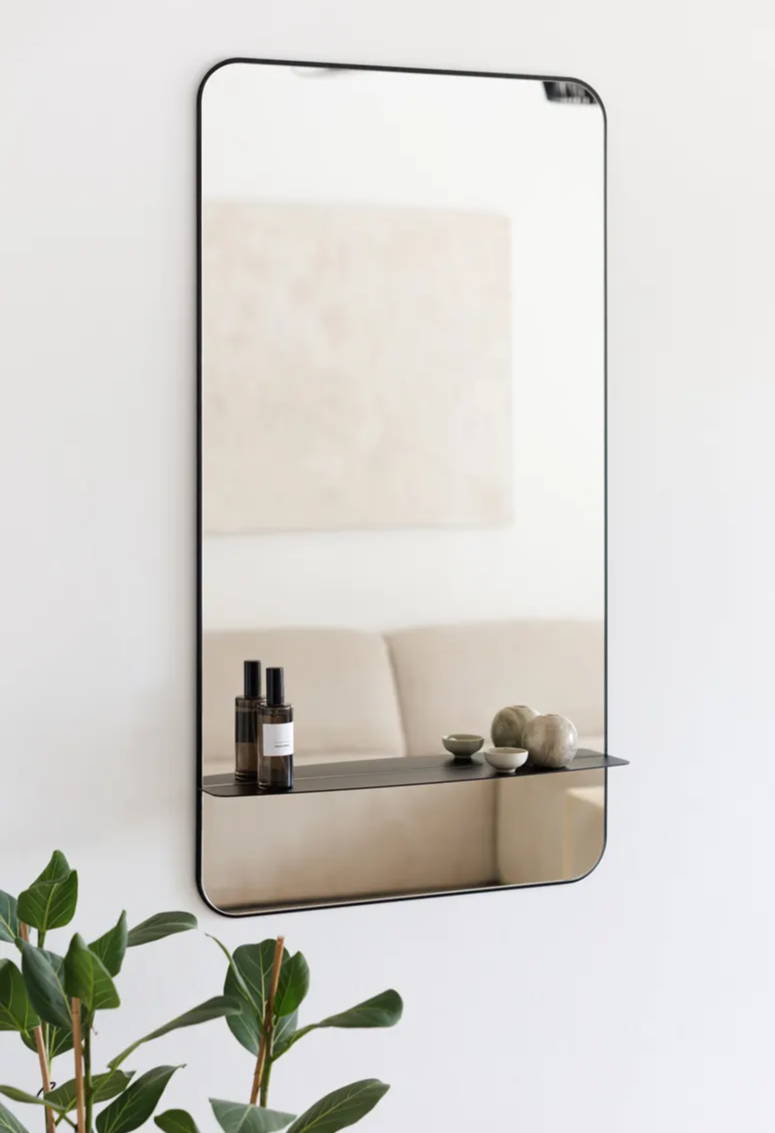 As a home accessory, a black metal mirror with shelf | metal booth