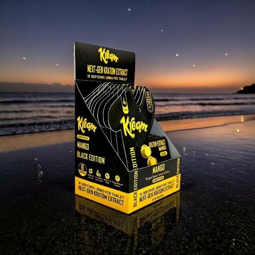 Display of Klean kanteen products at sunset by the beach.