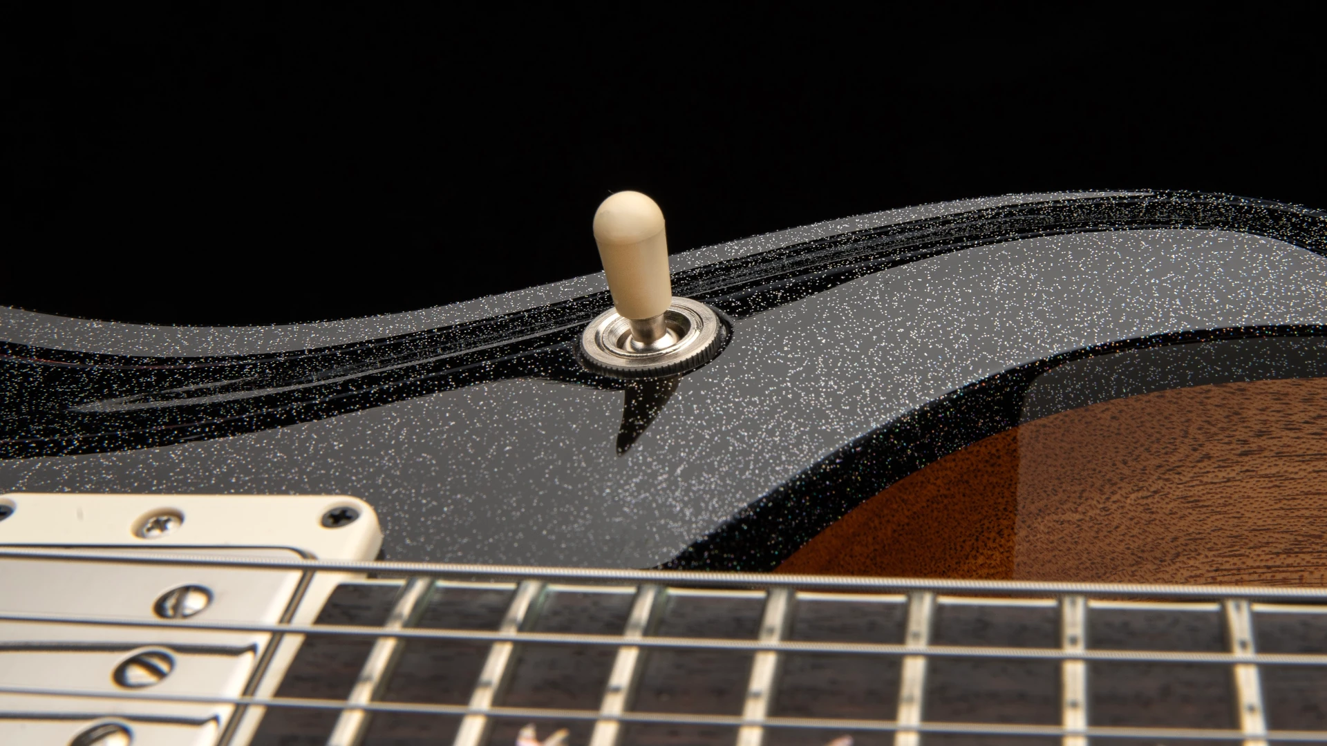 Close-up of a PRS McCarty 594 guitar's toggle switch and neck.