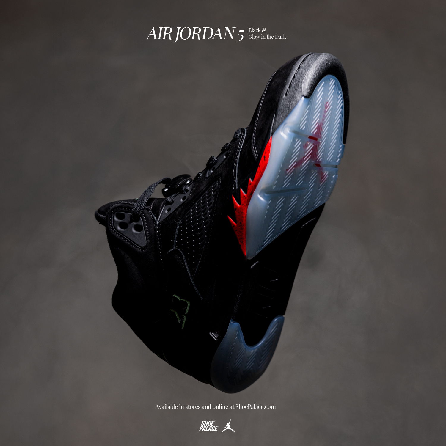 A close-up of a black and red Air Jordan 5 sneaker.