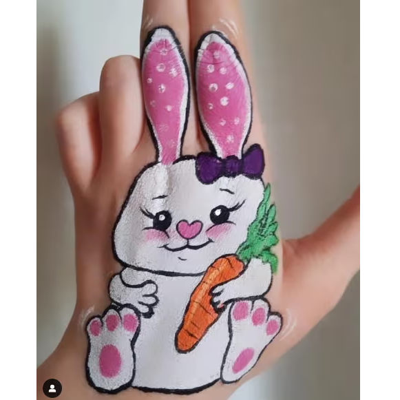 cute easter bunny face paint on hand with big ears and carrot