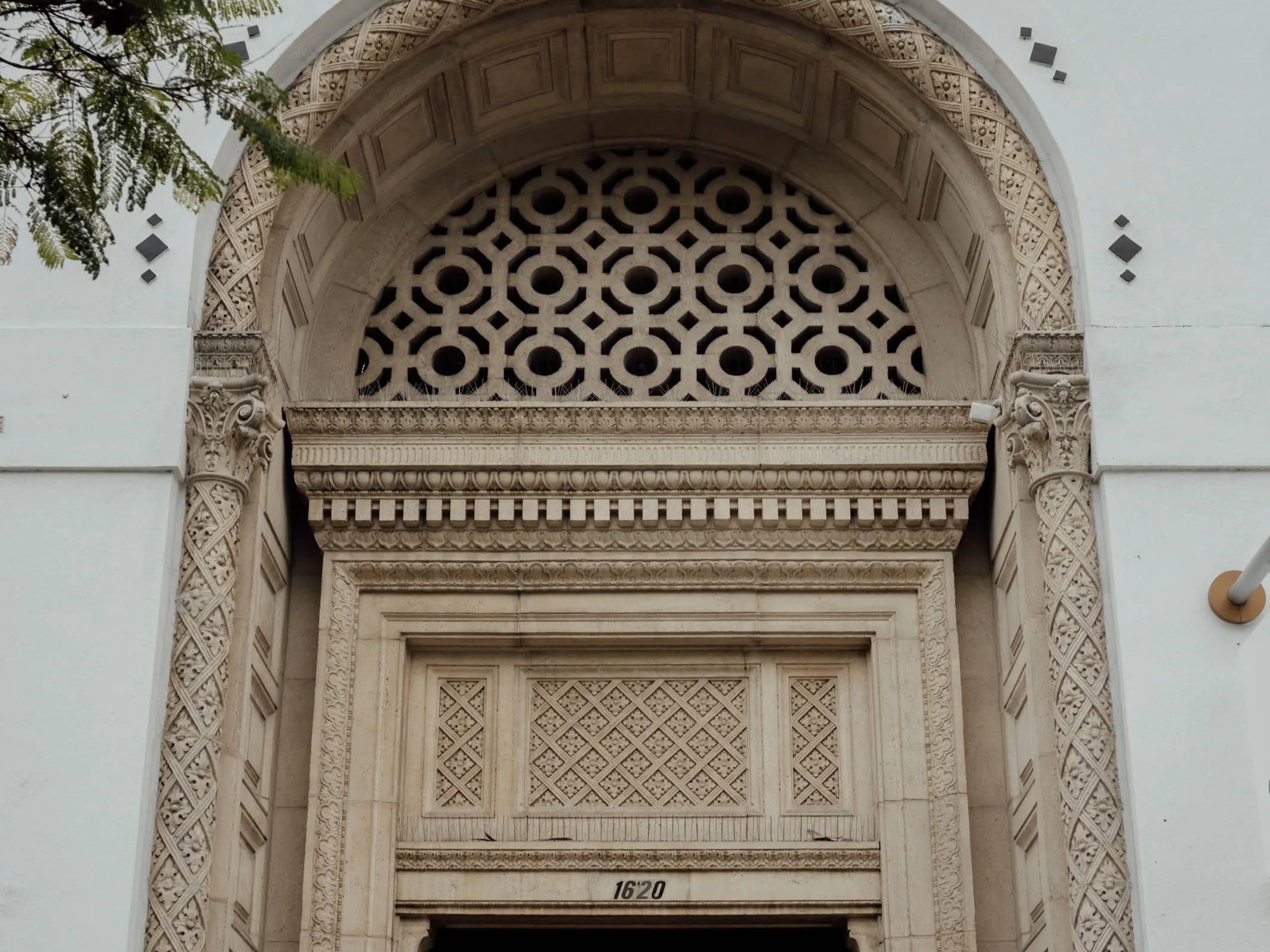 Large entryway arch of an old church in San Diego Cortez Hill district 