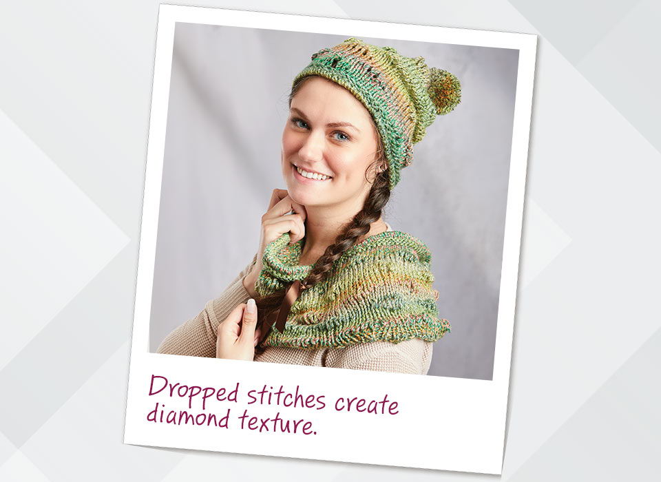 Woman wearing a knitted hat and scarf with dropped stitches to create diamond texture