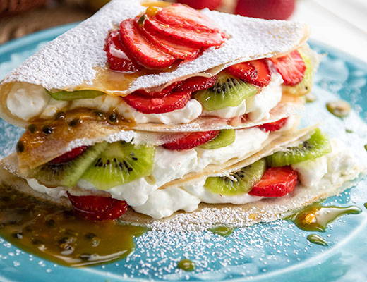 Image of Organic Strawberry and Organic Kiwi Crepes with Passion Fruit Sauce