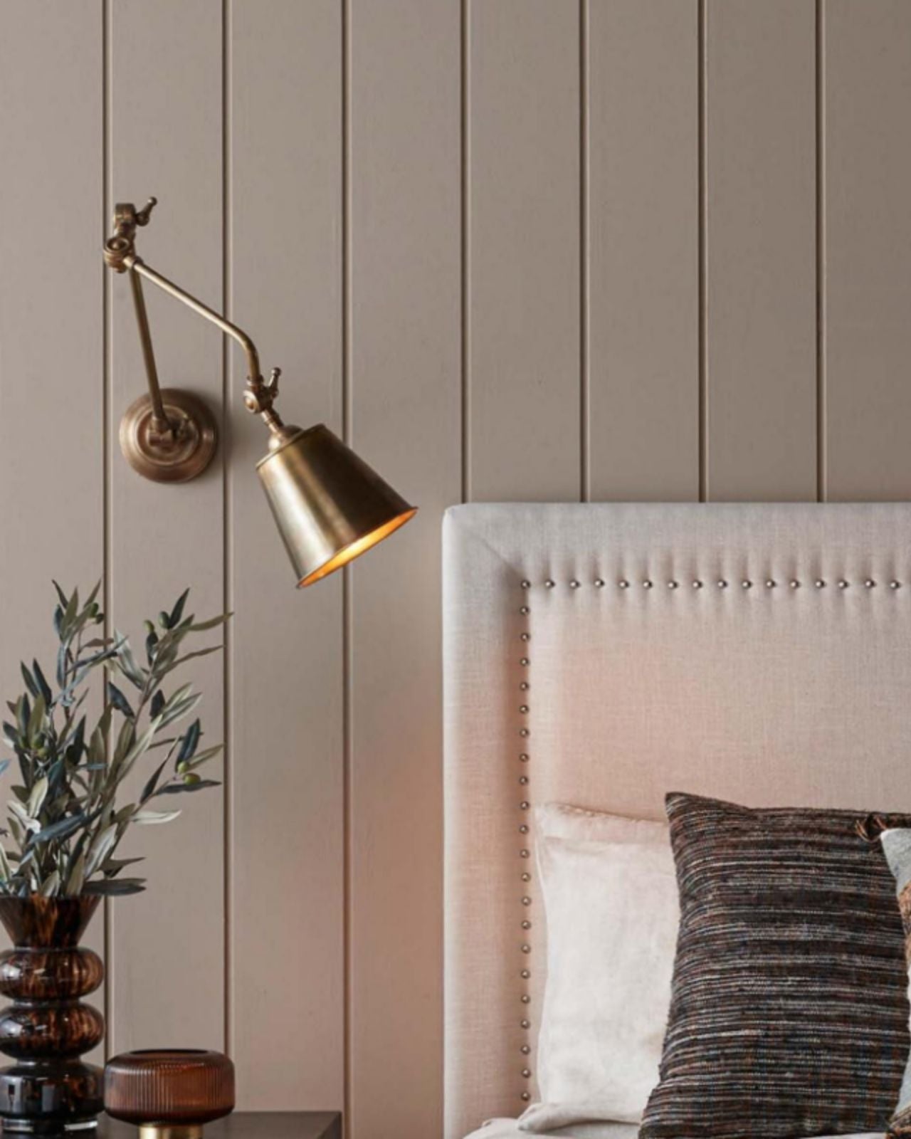 Adjustable Vintage Nickel Wall Light In a bedroom