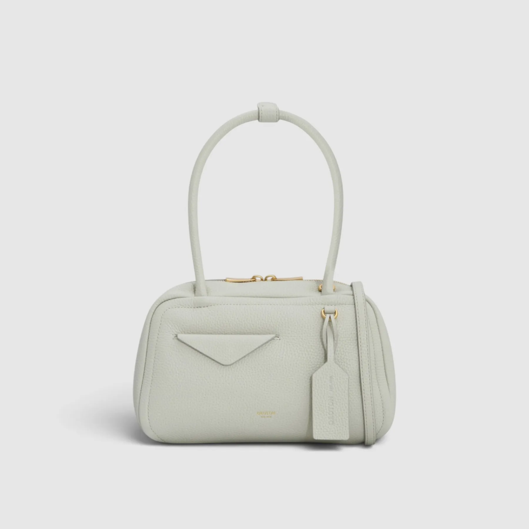 A small, light gray handbag with a top handle and zipper closure.