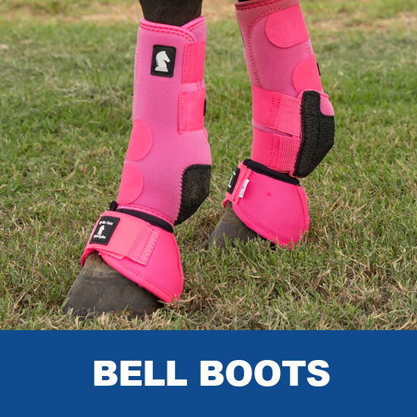 Pink bell boots on a horse's hooves, displayed on grass.