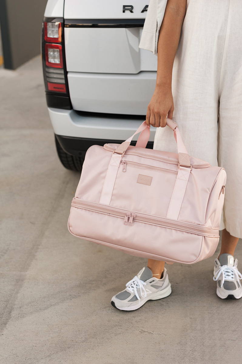 CALPAK Stevyn Duffel Bag in Pink Sand.