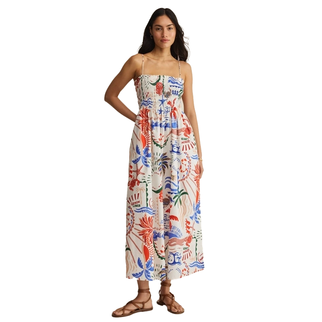 Young woman wearing a colorful floral maxi dress.