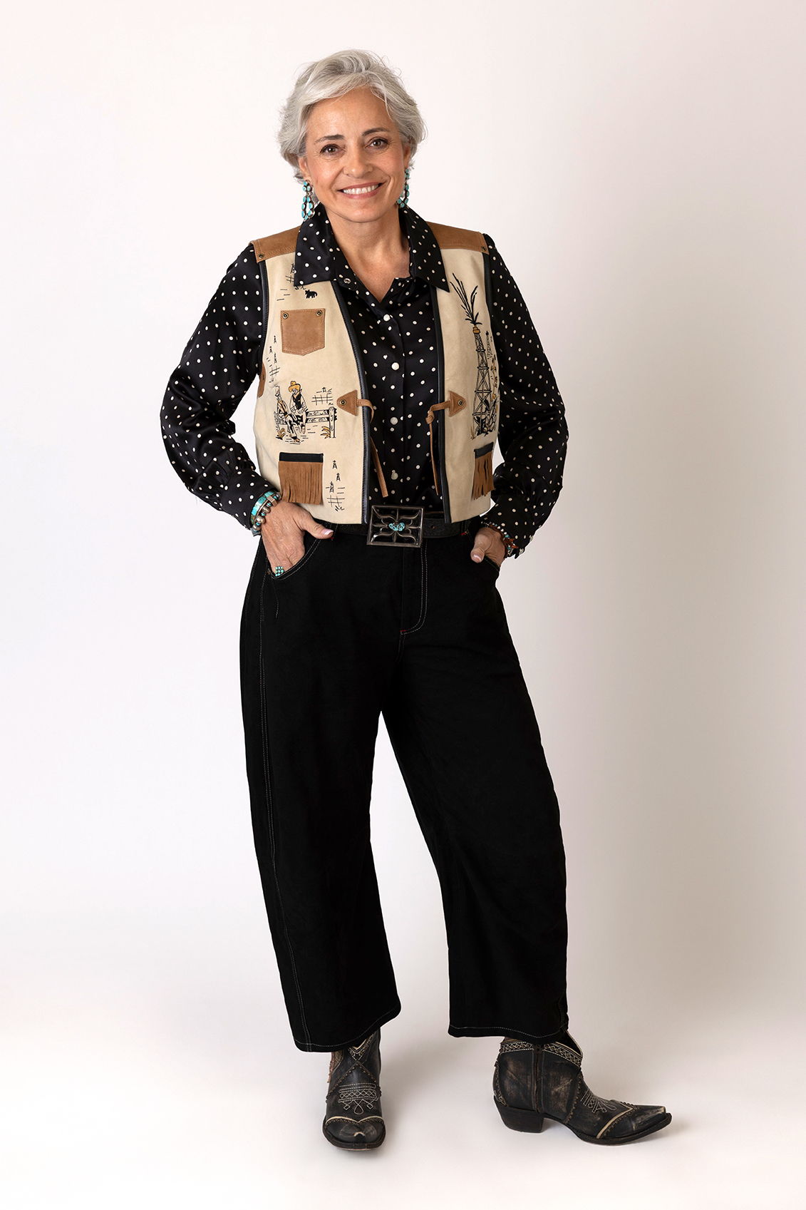 Hedy wearing the Spew Blouse with the Boom & Bust Vest and the Betty Barrel Pants with Double D Ranch jewelry and accessories.