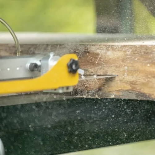 A log being sliced with ease due to auto lube system